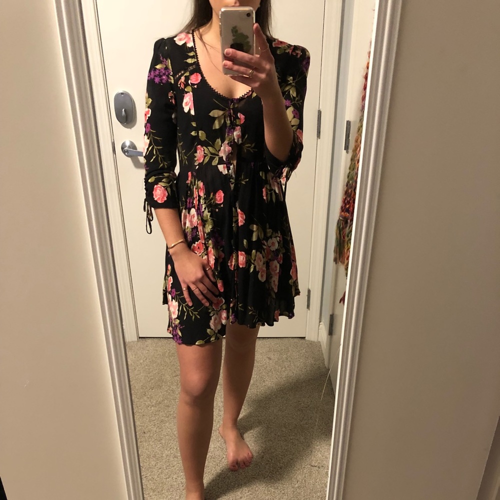 Floral button up dress with lace up back detail!